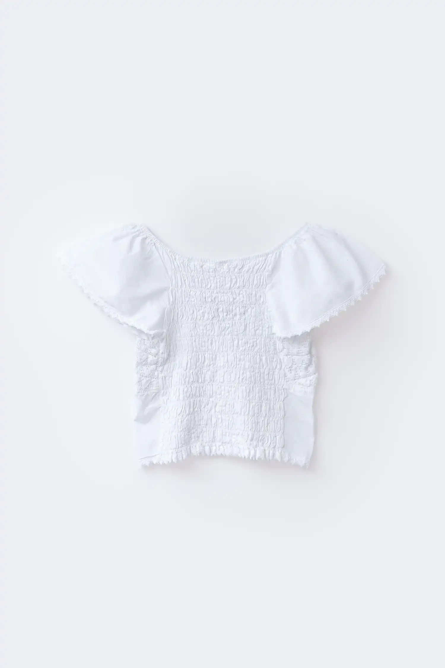 Blusa ibicenca blanca de mujer vista trasera